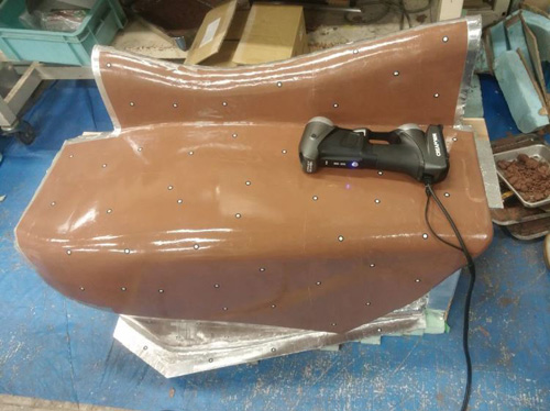 racing car clay model of the left side fairing ready to be 3d scanned by the HandySCAN 