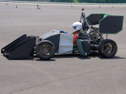 Test driving a racing car from student engineering team on a speedway