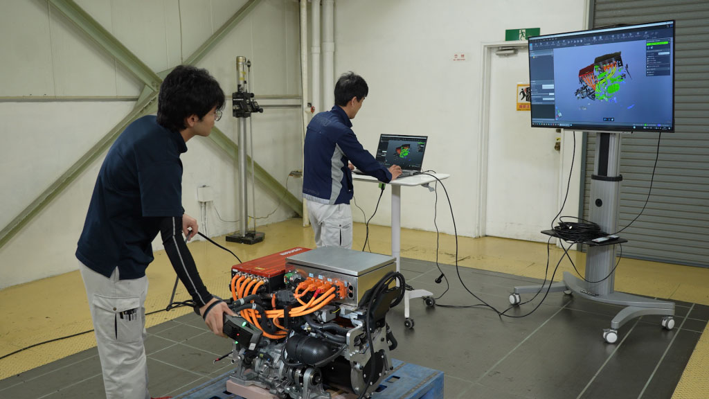 A member of the Phiaro team scanning an electric vehicle battery