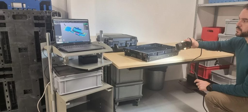 Technician using Creaform’s Go!SCAN 3D scanner.