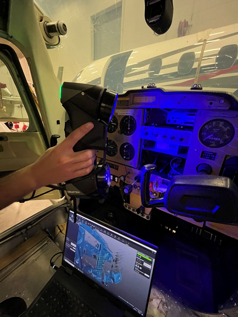 A technician observes a live view of a 3D scan in VXelements.