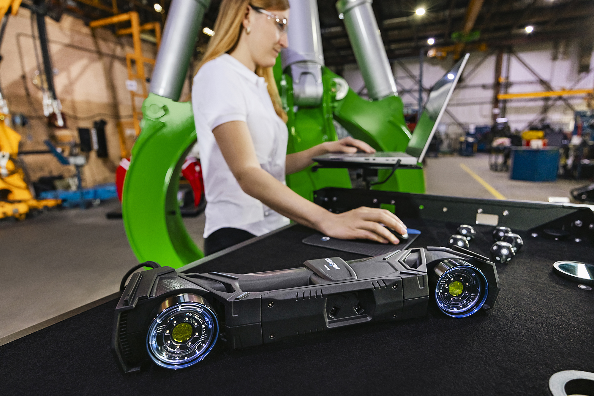 Engineer looking at the 3D model captured with the portable HandySCAN 3D|MAX Series on the production floor.