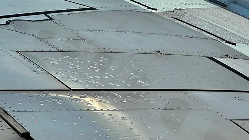 A picture of the dents on WestJet aircraft wing caused by the hailstorm.