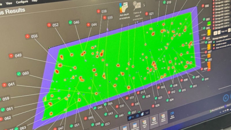 A computer monitor displaying the Aircraft module and dents on a component of a plane.