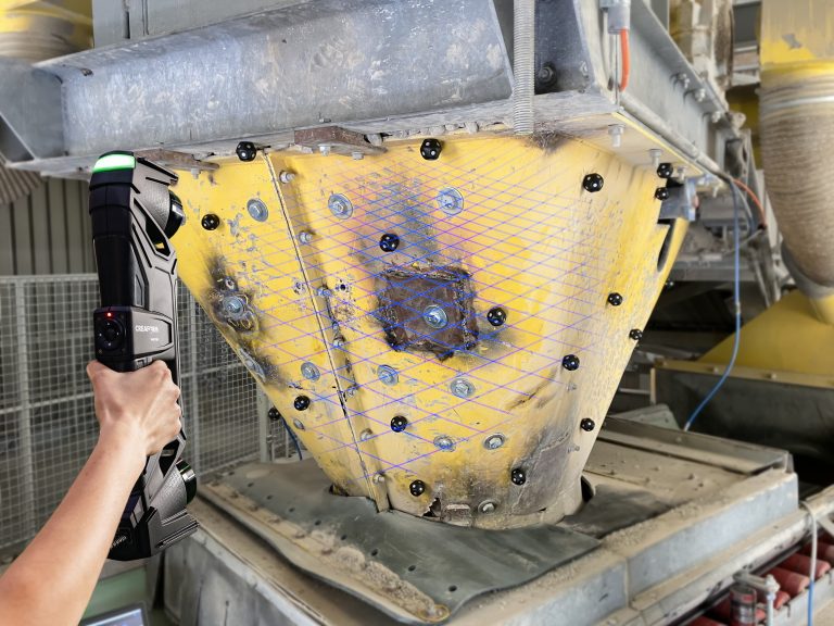 A user 3D scanning the transfer funnel with the HandySCAN Max