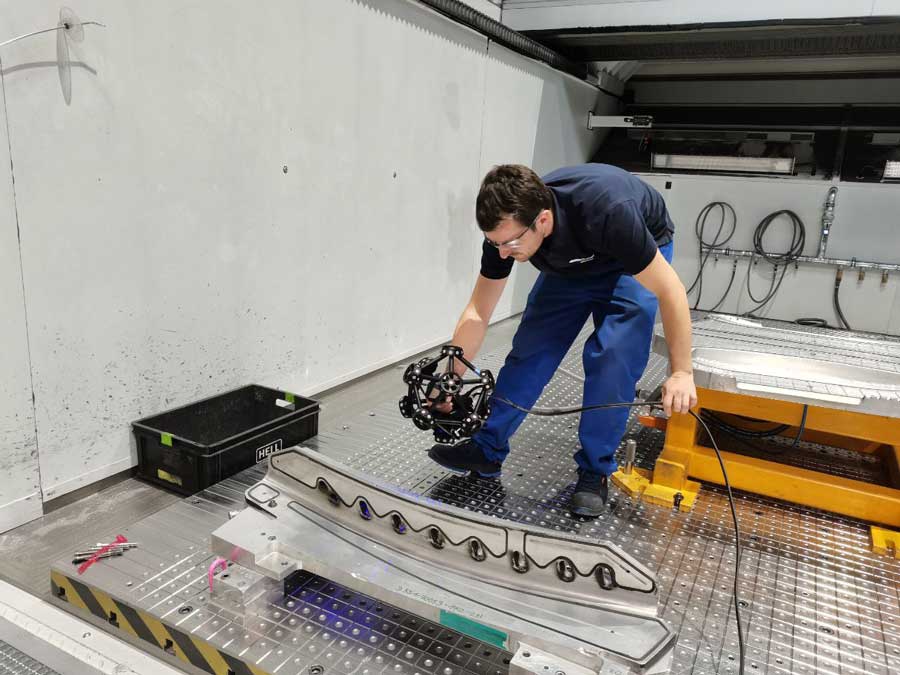 A team member scans an aerospace component with the MetraSCAN 3D