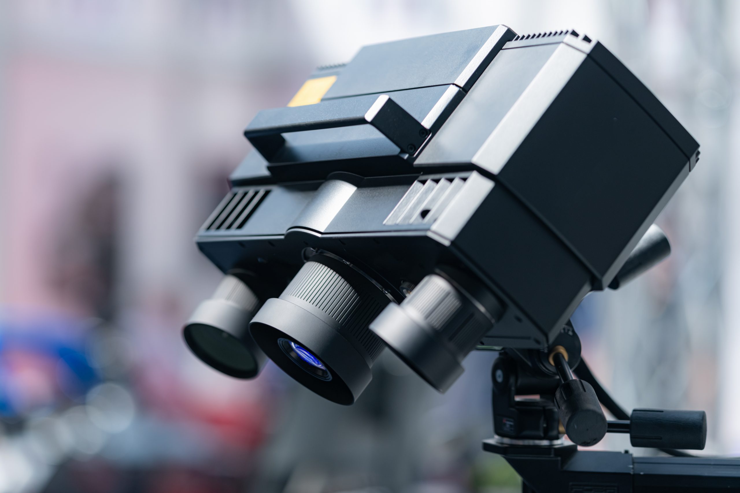 Close up of a black optical blue light 3D scanner