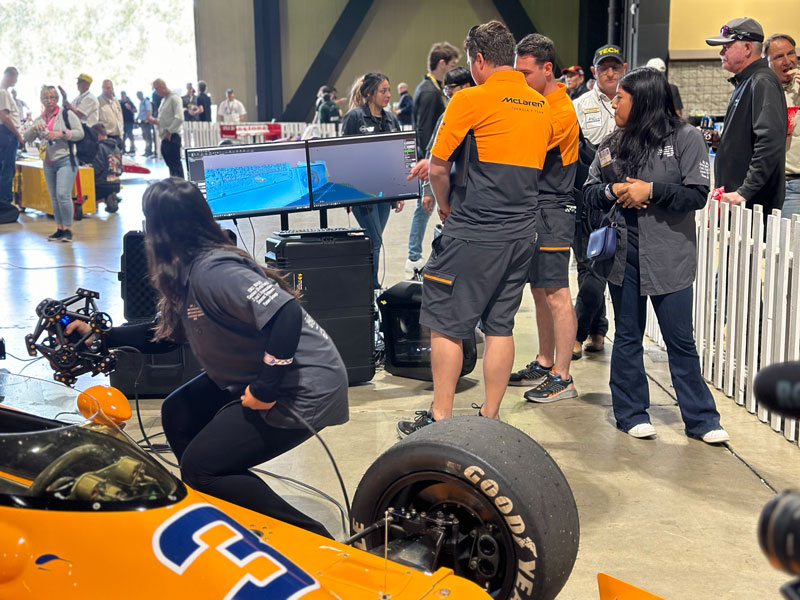A student examines the results of a 3D scan of a race car in VXmodel.