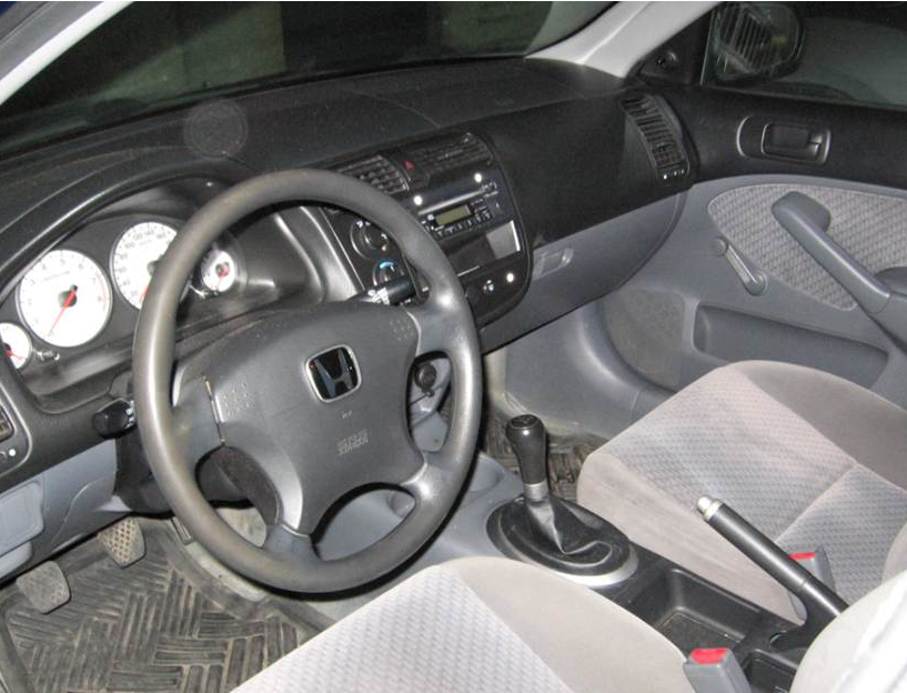 Close up of SFM employee wearing a white helmet and a respirator, using a MetraSCAN 3D to scan a transformer tank