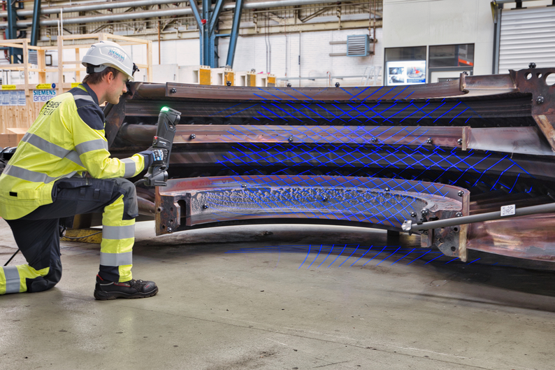 Technician scanning the guide vane carrier of a gas turbine with the HandySCAN 3D|MAX Series