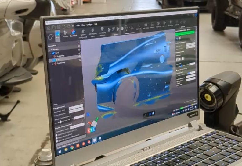A computer displaying a race vehicle part in Creaform Metrology Suite™ scanning software.