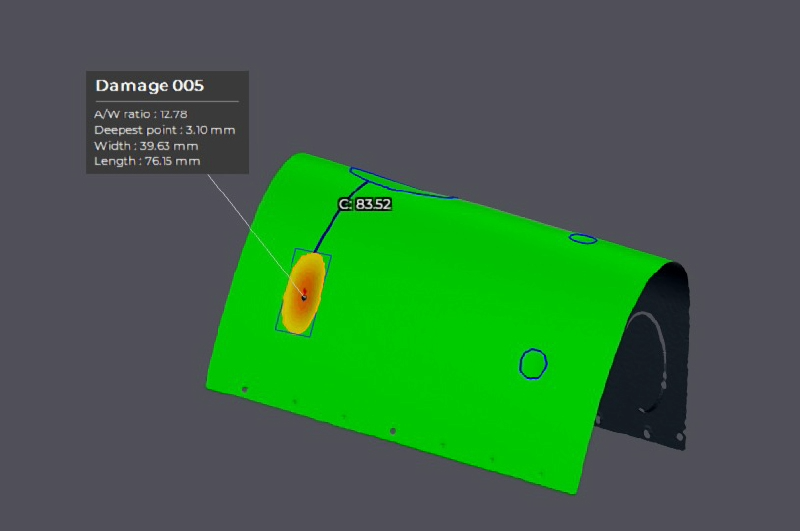 3D scan visualization of a curved metal panel showing highlighted damage area with measurement details