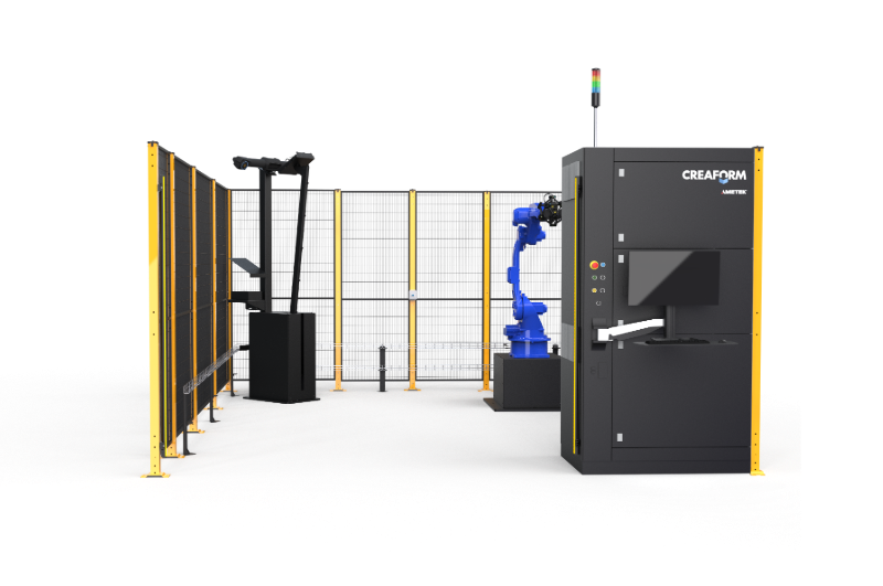 The M2 measuring cell with blue robot, table, calibration arm and Creaform control unit inside the safety enclosure
