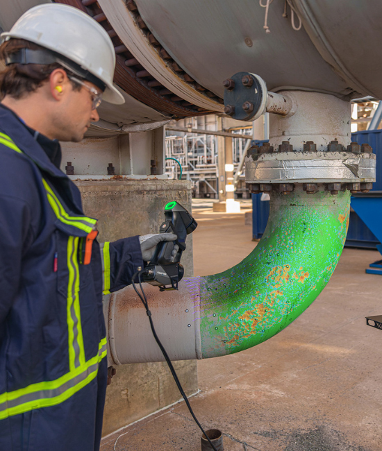 Man scanning a pipe elbow with the HandySCAN 3D BLACK