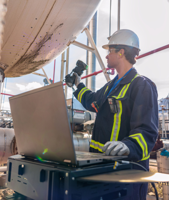 Man scanning external damages on a cylindrical tank