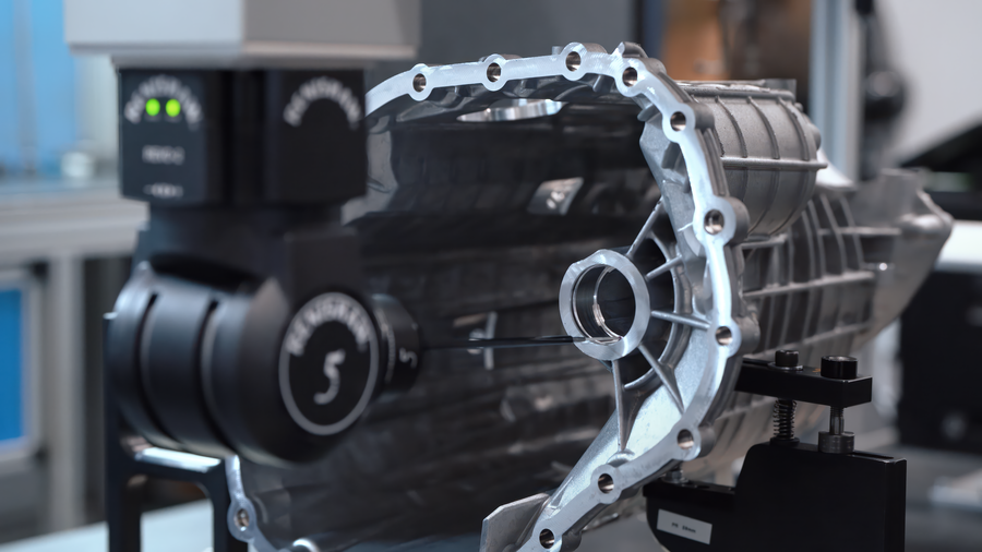 Automotive casting being inspected using a CMM probe to verify dimensional accuracy