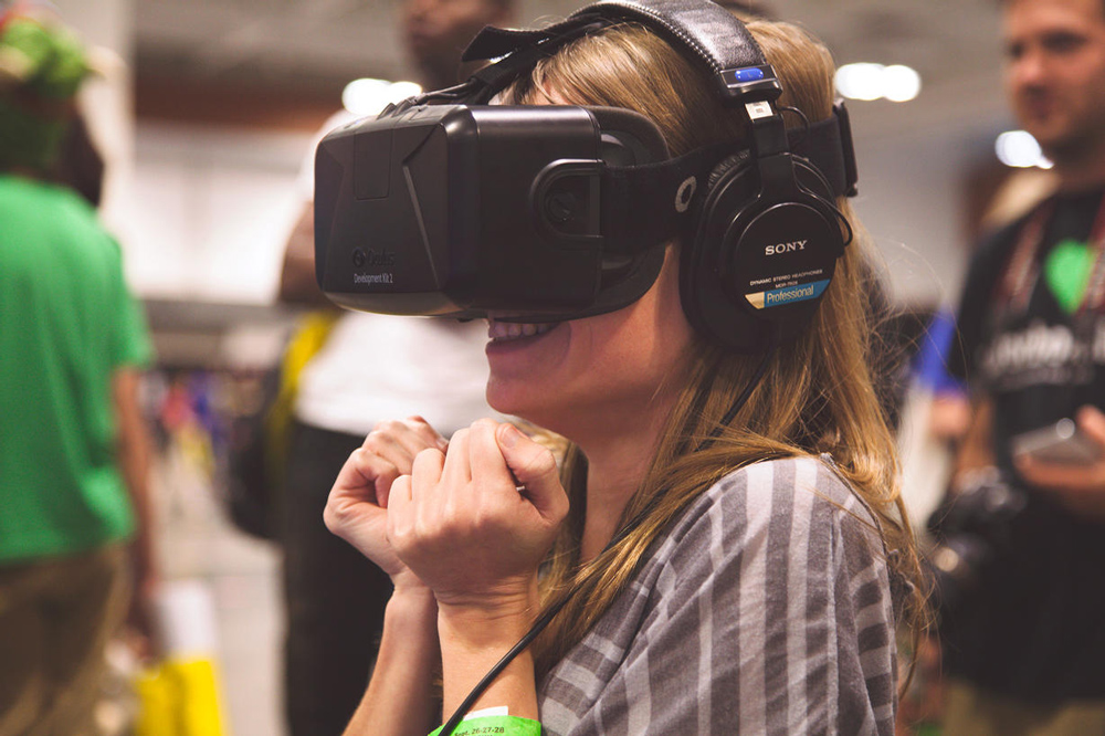 Girl testing Occulus rift virtual reality headset