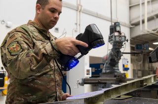Army sergent 3D scans an aircraft structure at Air Force Base