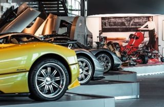 Several cars, motorcycle and pictures in the Pagani Museum