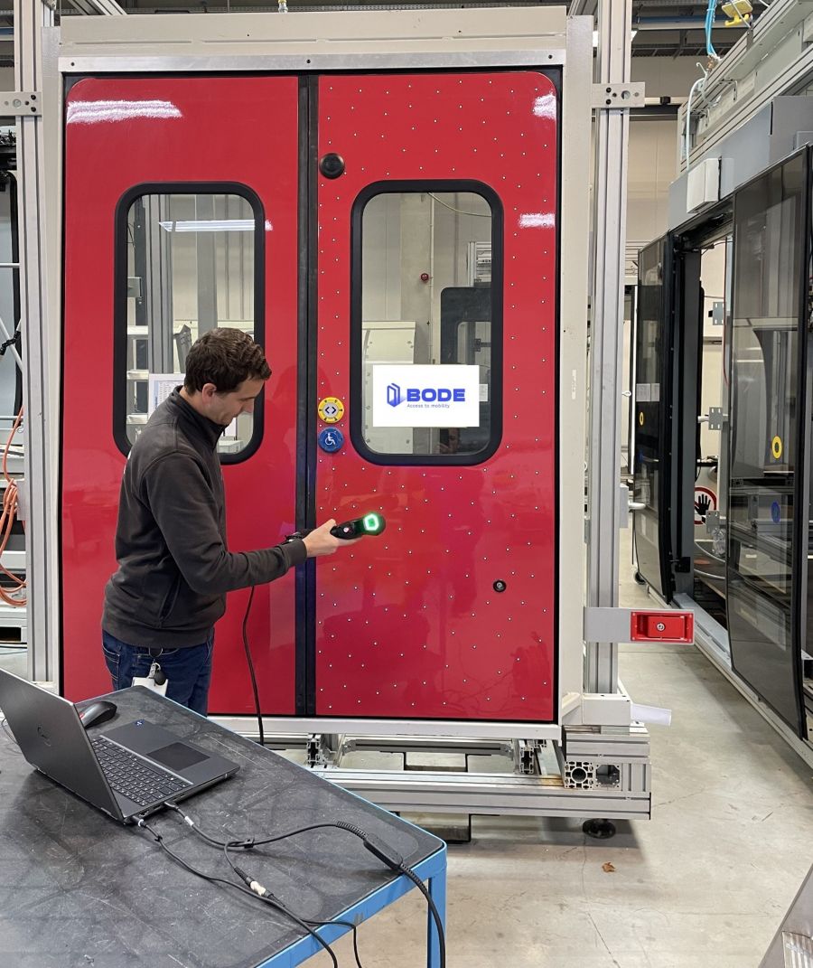A technician uses the HandySCAN BLACK+ Elite to scan a door system directly in the test hall.