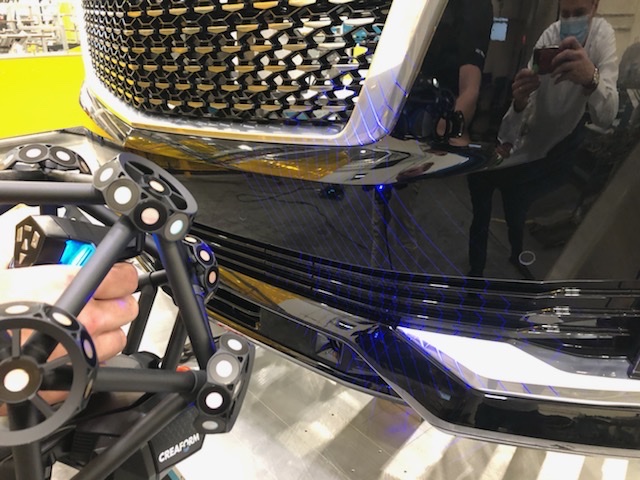 MetraSCAN 3D scanning a Cadillac car front grid